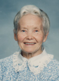 Marie Thomas Davis Dewegeli, an elderly woman with white hair in a pale blouse with an embroidered collar.